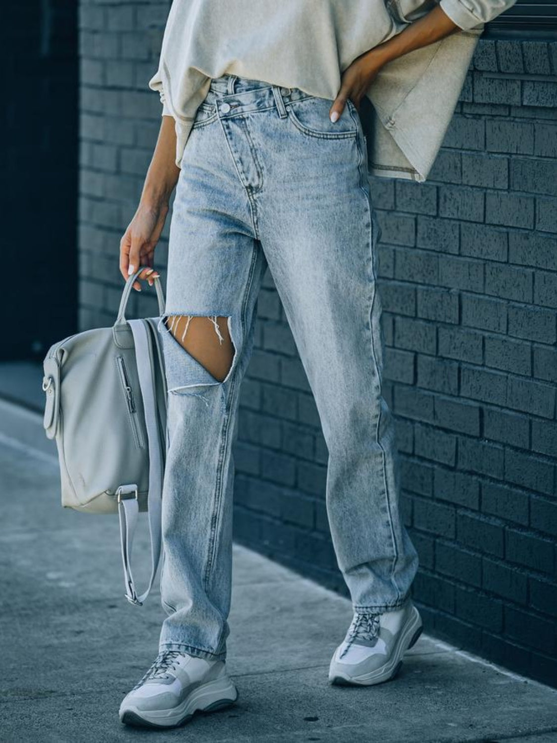 Distressed Asymmetric Waist Jeans Trendsi