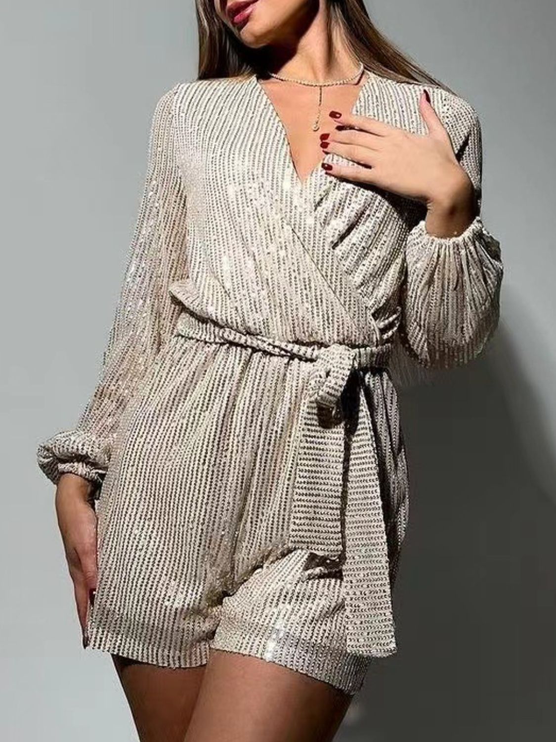 Full Size Sequin Surplice Tie Waist Long Sleeve Romper Trendsi